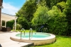 Bezauberndes Einfamilienhaus mit Innen- und Außenpool in exponierter Wohnlage - Garten mit Pool